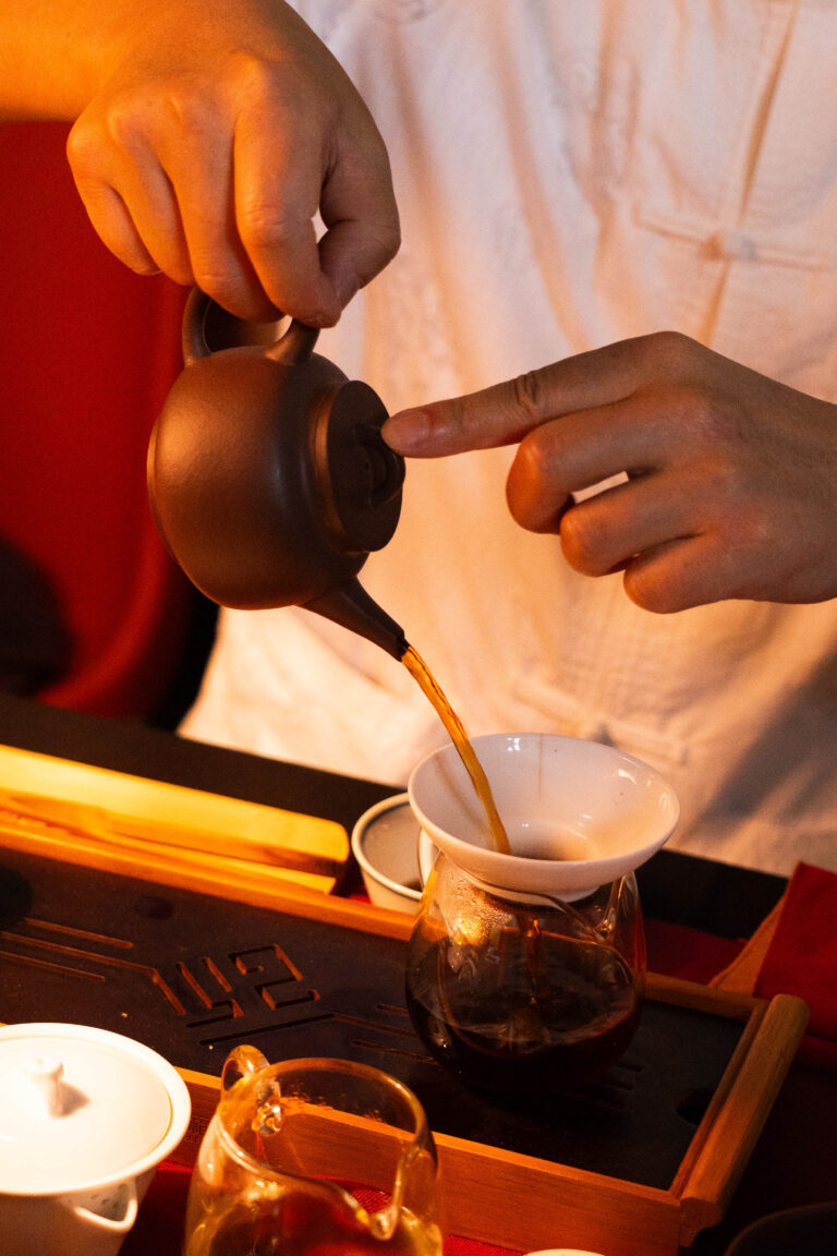 Orijin Tea pours Pu-Erh